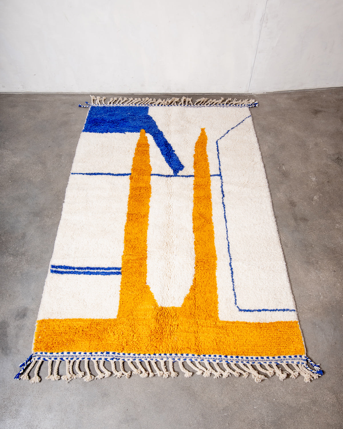 Modern, designer, handcrafted Berber rug from Morocco. Beniourain carpet with beautiful colours and patterns and fluffy wool texture.